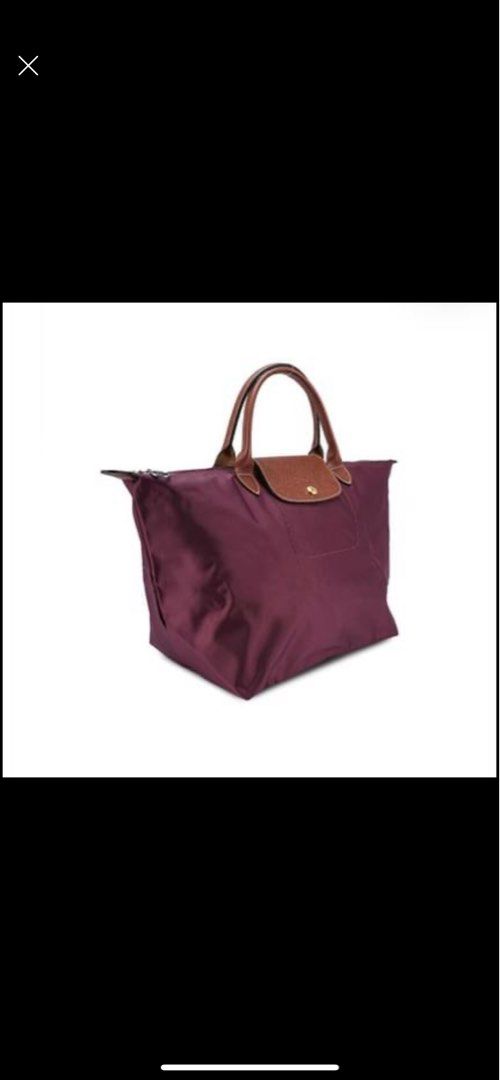 Longchamp short handle medium size (Category: Luxury Bags & Wallets) located in Malvar. Submitted by jerisse (Listing ID 1234547571, Image 2). Description: Selling my longchamp bag color in Prune. RFS: Would like to buy a different color Inclusions: Paperbag and card PM for actual pictures. Bought for 5000 in IG store (pasabuy from London).