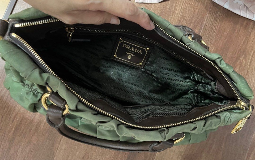 Preowned Prada Tessuto Gaufre Shoulder bag (Category: Bags & Wallets) located in Singapore. Submitted by kvril (Listing ID 1234588558, Image 3). Description: Letting go a under used Prada Tessuto Gaufre shoulder bag. Bag is still in good condition. Item comes with bag, shoulder strap, dust bag, authentic bag and receipt. Bag can be hand carry, sling or cross body. Please do not low ball and will not respond to low baller. Deal at seller’s conveni