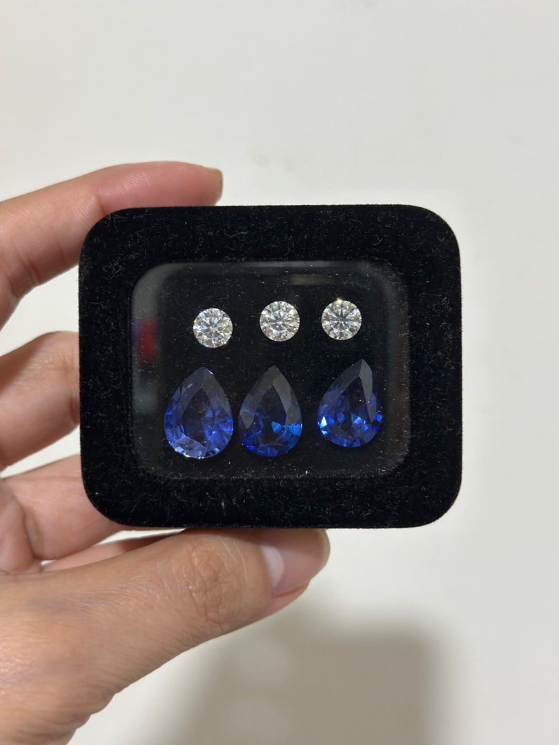 AUTHENTIC Moissanite and Blue Tanzanite Stones Set (Category: Precious Stones) located in Pasig City. Submitted by shashishop (Listing ID 1229958477, Image 1). Description: RFS: Not proceeding with custom jewelry making - 24.98 ct Blue Tanzanite - 3 ct Moissanite - Bought in Rakimah Jewelry Greenhills in 2021. See attached receipt Set bought at PHP 17,400.