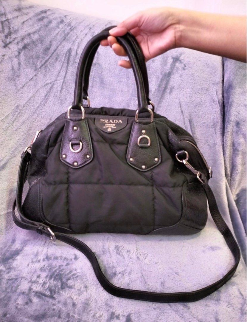 Authentic Two Way Prada Gauffre and Leather Bowler Bag (Category: Luxury Bags & Wallets) located in Rizal. Submitted by SummerPeaCloset (Listing ID 1230001007, Image 2). Description: Authentic Two Way Prada Gauffre and Leather Bowler Bag With long strap and padlock (without key) Reduced price from 24,500.