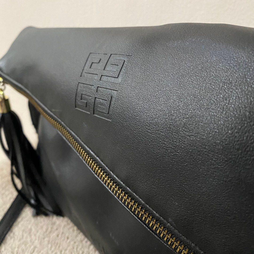 Givenchy 2 Way Shoulder & Clutch Bag Pouch Black Leather (Category: Luxury Bags & Wallets) located in Taguig. Submitted by blackcaat (Listing ID 1229952301, Image 2). Description: Givenchy 2 Way Shoulder & Clutch Bag Pouch Black Leather 21x33cm NEW F/S.