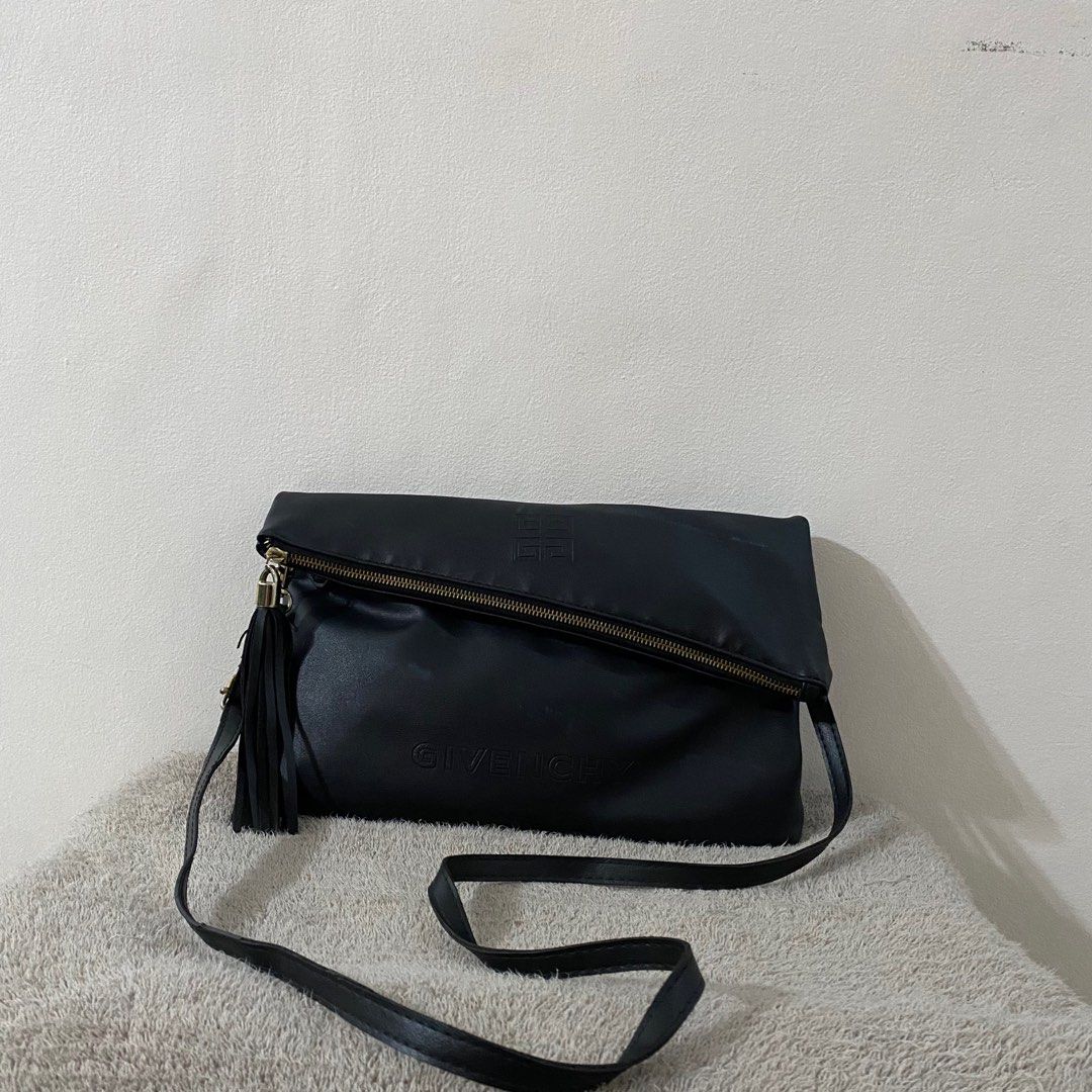 Givenchy 2 Way Shoulder & Clutch Bag Pouch Black Leather (Category: Luxury Bags & Wallets) located in Taguig. Submitted by blackcaat (Listing ID 1229952301, Image 1). Description: Givenchy 2 Way Shoulder & Clutch Bag Pouch Black Leather 21x33cm NEW F/S.