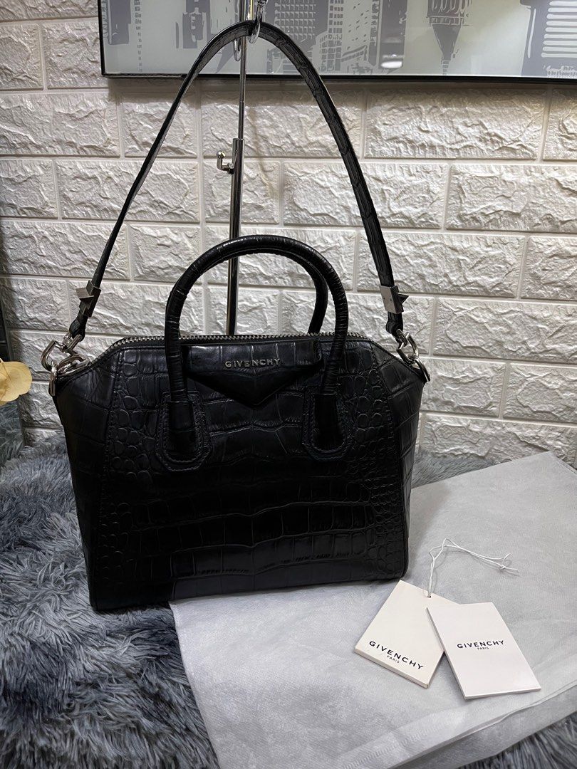 Givenchy Antigona in Croc Skin (Category: Luxury Bags & Wallets) located in Quezon City. Submitted by christineboller (Listing ID 1229957896, Image 1). Description: Givenchy Medium Antigona in Black Croc Skin Leather Leather. In 9.8/10 condition, pristine GHW and strap. Serial no. 3CO173. No scratches on sides, comes with tag and dustbag for only P58k. .