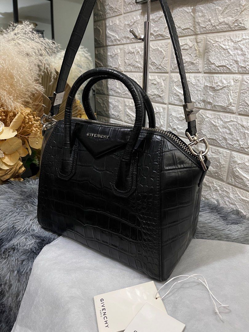Givenchy Antigona in Croc Skin (Category: Luxury Bags & Wallets) located in Quezon City. Submitted by christineboller (Listing ID 1229957896, Image 3). Description: Givenchy Medium Antigona in Black Croc Skin Leather Leather. In 9.8/10 condition, pristine GHW and strap. Serial no. 3CO173. No scratches on sides, comes with tag and dustbag for only P58k. .