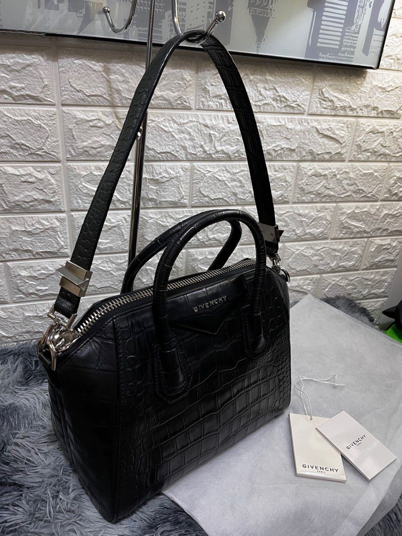 Givenchy Antigona in Croc Skin (Category: Luxury Bags & Wallets) located in Quezon City. Submitted by christineboller (Listing ID 1229957896, Image 2). Description: Givenchy Medium Antigona in Black Croc Skin Leather Leather. In 9.8/10 condition, pristine GHW and strap. Serial no. 3CO173. No scratches on sides, comes with tag and dustbag for only P58k. .