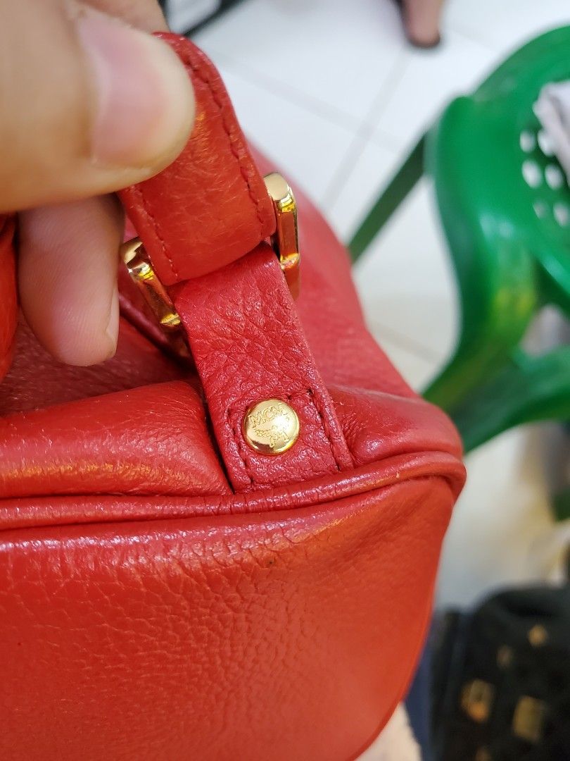 Original Mcm Mini backpack (Category: Luxury Bags & Wallets) located in Sogod. Submitted by silverriver_b6b903 (Listing ID 1229837013, Image 2). Description: Very nice Bag Durable pure leather Red orange Color.
