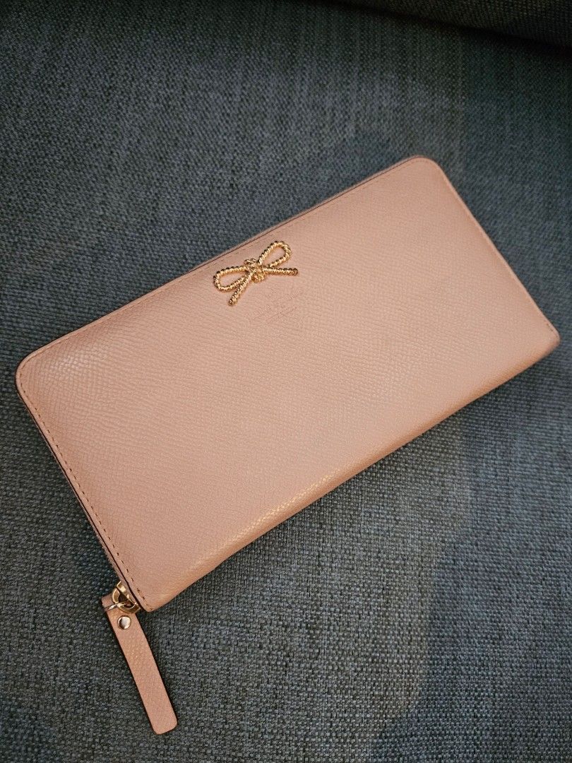 Kate Spade Large Zippy Wallet (Category: Wallets & Card holders) located in Taguig. Submitted by declutter.project (Listing ID 1234830477, Image 1). Description: Guaranteed authentic Issues: exterior needs cleaning, small ink stains on zipper pull (as seen in last photo).