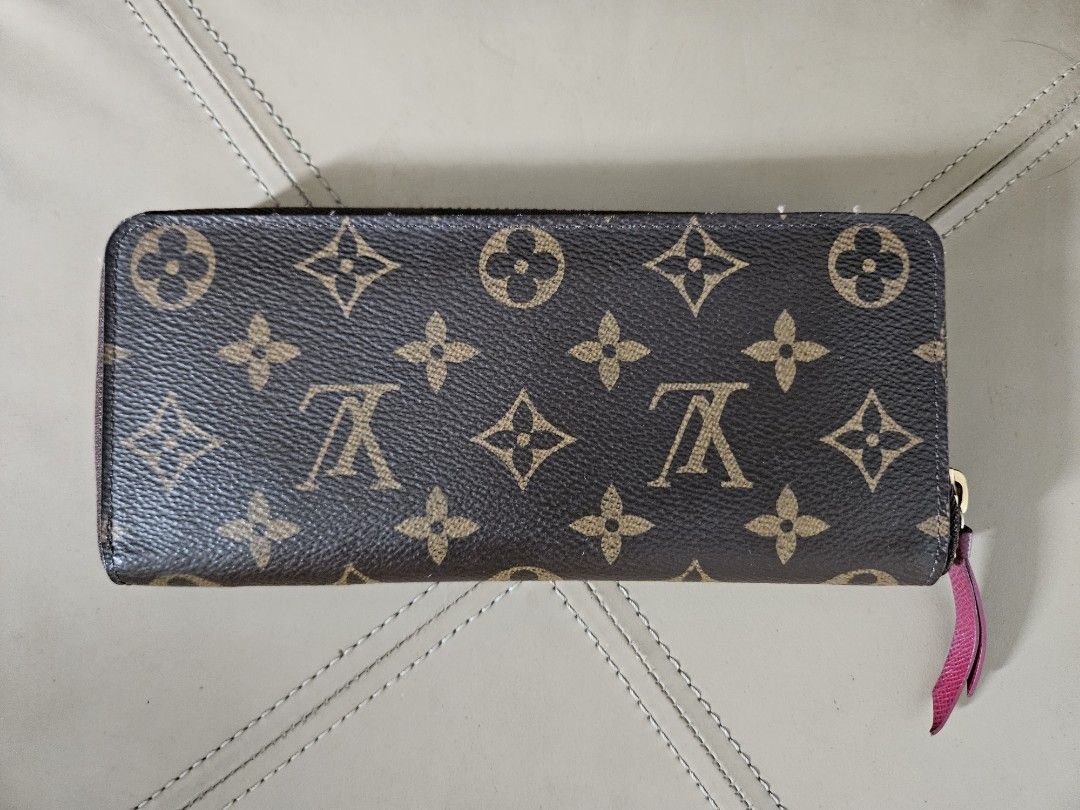 Louis Vuitton Clemence Wallet Monogram Canvas Fuchsia (Category: Luxury Bags & Wallets) located in Taguig. Submitted by declutter.project (Listing ID 1234829210, Image 3). Description: Guaranteed authentic Comes with original dust bag and box Only issue: some fading on coin zipper hardware.