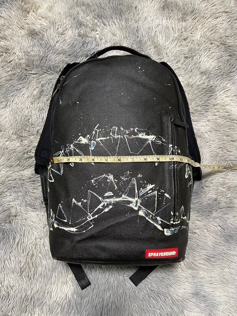 Sprayground broken glass deals shark backpack