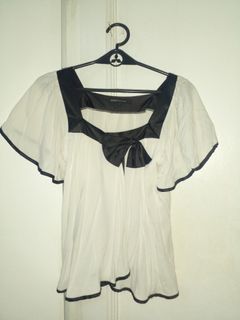 White top with black ribbon
