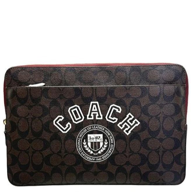 Shop Coach Laptop Sleeve In Signature Canvas With Coach Varsity