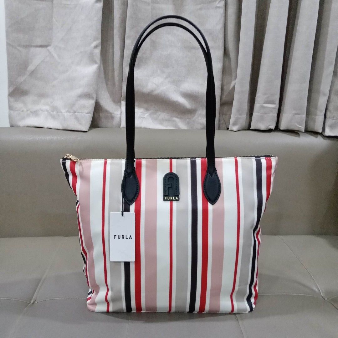 Furla Medium Tote Bag (Category: Luxury Bags & Wallets) located in Taguig. Submitted by esa.agustin (Listing ID 1230063681, Image 1). Description: Original Furla nylon stripe medium size bag. With dust bag. carecard and tags. Bought in US..