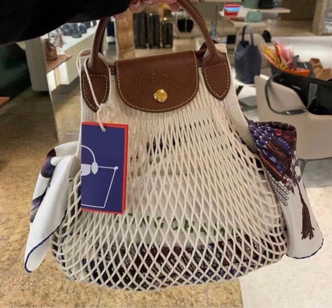 Longchamp Le Pliage Filet (Category: Luxury Bags & Wallets) located in Taguig. Submitted by sourcedbym (Listing ID 1230028354, Image 2). Description: Brand new. Ecru, Black, Navy, Blush, Hot Pink colors are available. Have one of each. Retail in Rustans is 8,600 php. Free shipping within MMA via gogo express available. Same day delivery c/o buyer. PIOG. .