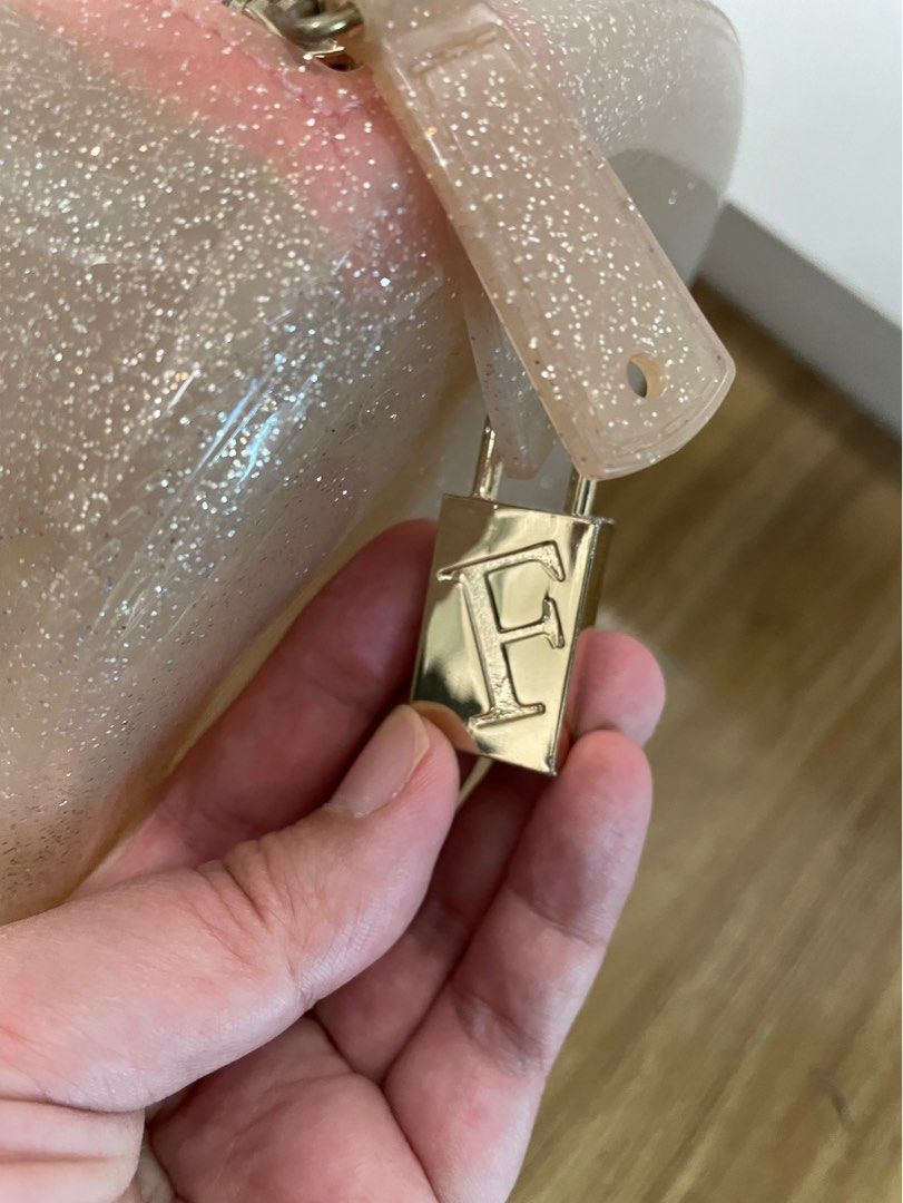 Furla Candy Bag (Free Shipping) (Category: Luxury Bags & Wallets) located in Mandaluyong City. Submitted by jasdeals (Listing ID 1230233338, Image 2). Description: Furla Candy Bag - light pink with shimmer No strap with twilly Pre-loved no issues .