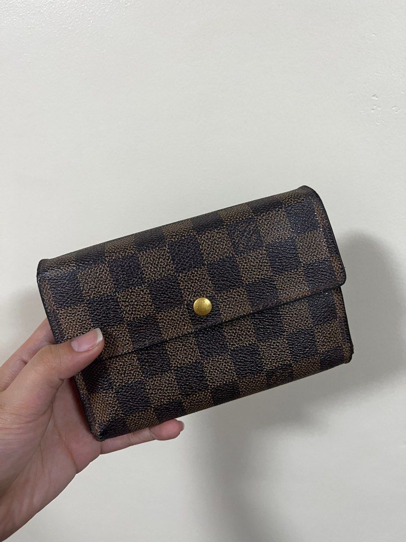 Authentic Louis Vuitton Damier Ebene Trifold Wallet (Category: Luxury Bags & Wallets) located in Quezon City. Submitted by declutterluxury (Listing ID 1230313805, Image 1). Description: My LV wallet needs a new home! • Guaranteed authentic • Has minor scuffs on the sides • Very good condition • Fits passport • No inclusions, only the wallet RFS: Too many wallets already. ALL SALES ARE FINAL. NO RETURN & REFUND..