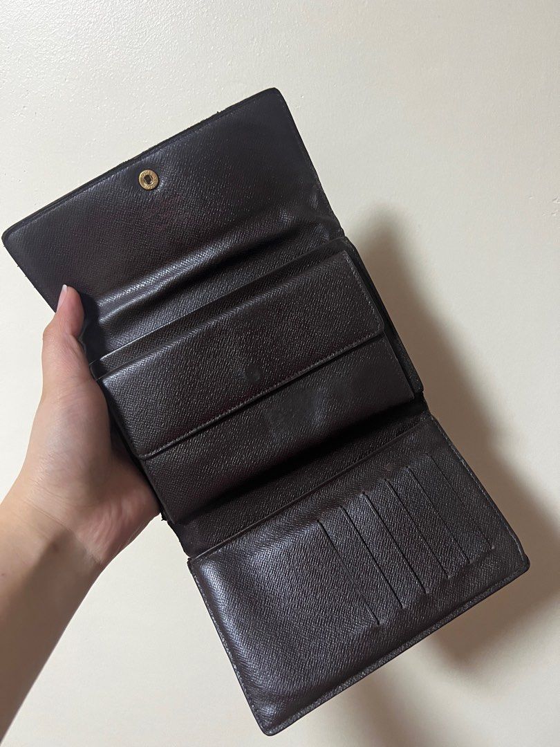 Authentic Louis Vuitton Damier Ebene Trifold Wallet (Category: Luxury Bags & Wallets) located in Quezon City. Submitted by declutterluxury (Listing ID 1230313805, Image 3). Description: My LV wallet needs a new home! • Guaranteed authentic • Has minor scuffs on the sides • Very good condition • Fits passport • No inclusions, only the wallet RFS: Too many wallets already. ALL SALES ARE FINAL. NO RETURN & REFUND..