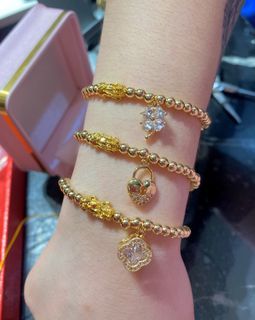 18karat piyao gold .10grams with charm bracelet