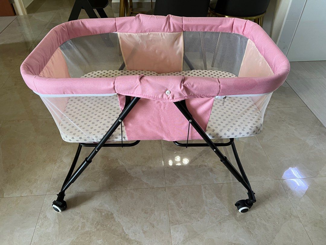 Foldable cot (Category: Cots & Cribs) located in Singapore. Submitted by cloveclothes (Listing ID 1230356867, Image 2). Description: Foldable cot lightly used. Measurements - 90cm L x 49cm W (inner mattress) Dimension of outer cot - 94cm length x 80cm height .