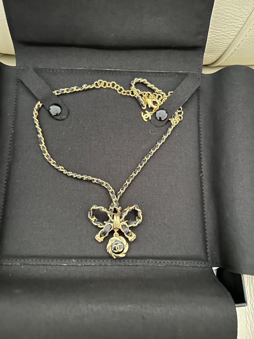Chanel ribbon necklace deals