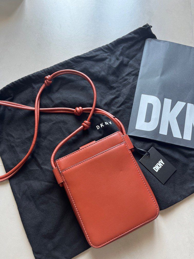 DKNY Brown Knot Strap Crossbody Bag (Category: Cross-body Bags) located in Makati City. Submitted by janille (Listing ID 1230549336, Image 3). Description: Brand New, never been used with tG, dustbag and paper bag This crossbody bag is a trendsetting accessory every fashion forward woman should have. Smooth and durable leather upper Foldover construct with magnetic closure Secure inner slip-in slot Easily accessible outer slip-in pocket Easy to c