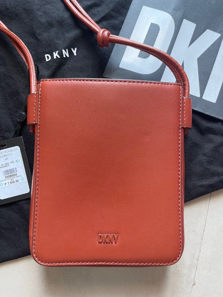 DKNY Brown Knot Strap Crossbody Bag (Category: Cross-body Bags) located in Makati City. Submitted by janille (Listing ID 1230549336, Image 2). Description: Brand New, never been used with tG, dustbag and paper bag This crossbody bag is a trendsetting accessory every fashion forward woman should have. Smooth and durable leather upper Foldover construct with magnetic closure Secure inner slip-in slot Easily accessible outer slip-in pocket Easy to c