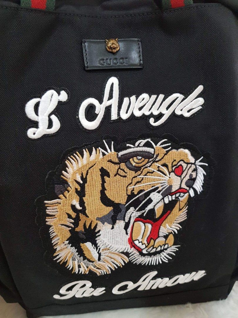 Gucci lion store backpack