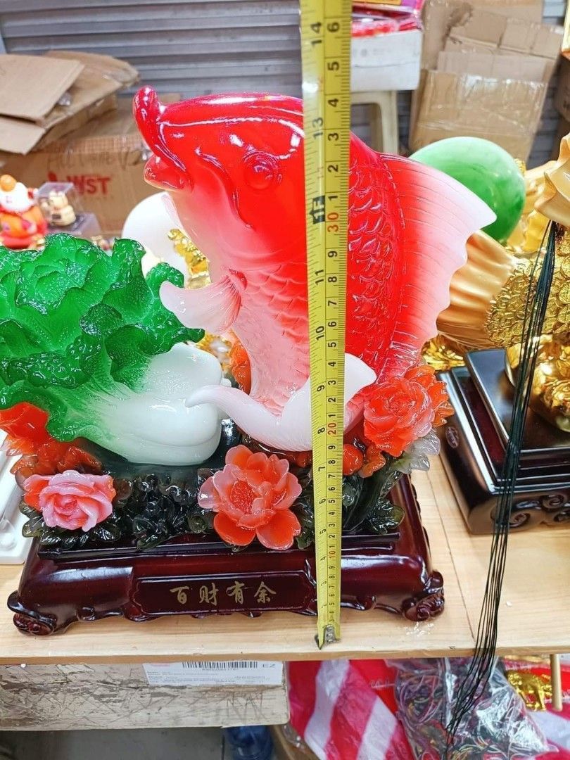 Red arowana fish hold pechay Fengshui display on Carousell