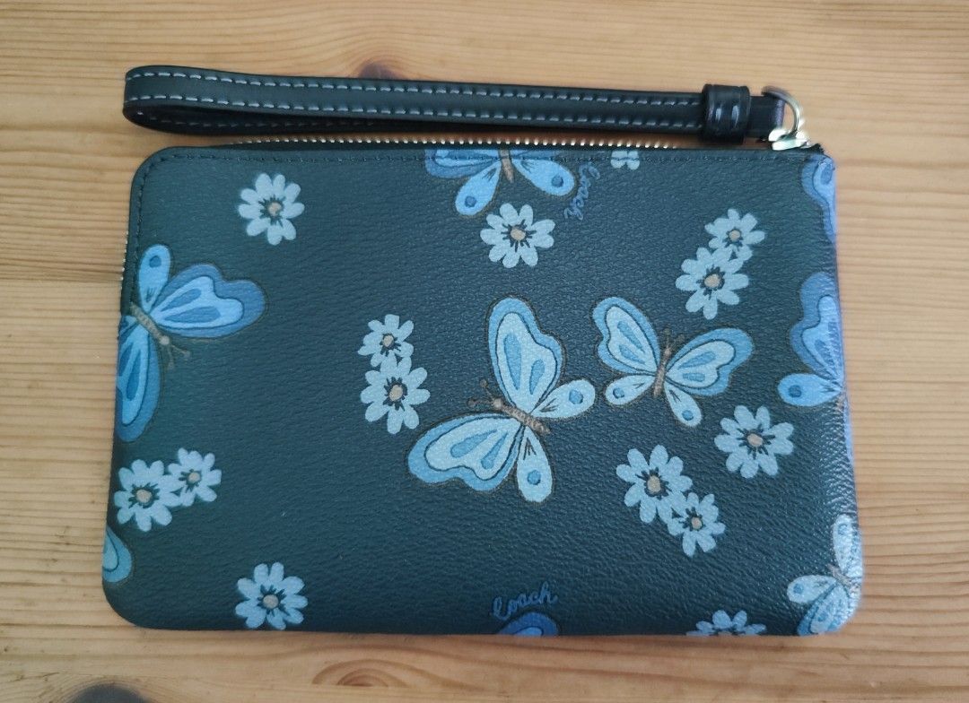 Corner zip wristlet shop with butterfly print