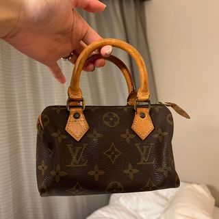 Sold at Auction: A Louis Vuitton Speedy Bag. LV canvas with brown leather  trim and handles. Lock with keys. Red textile interior. The top zip works  but is missing the puller. Please