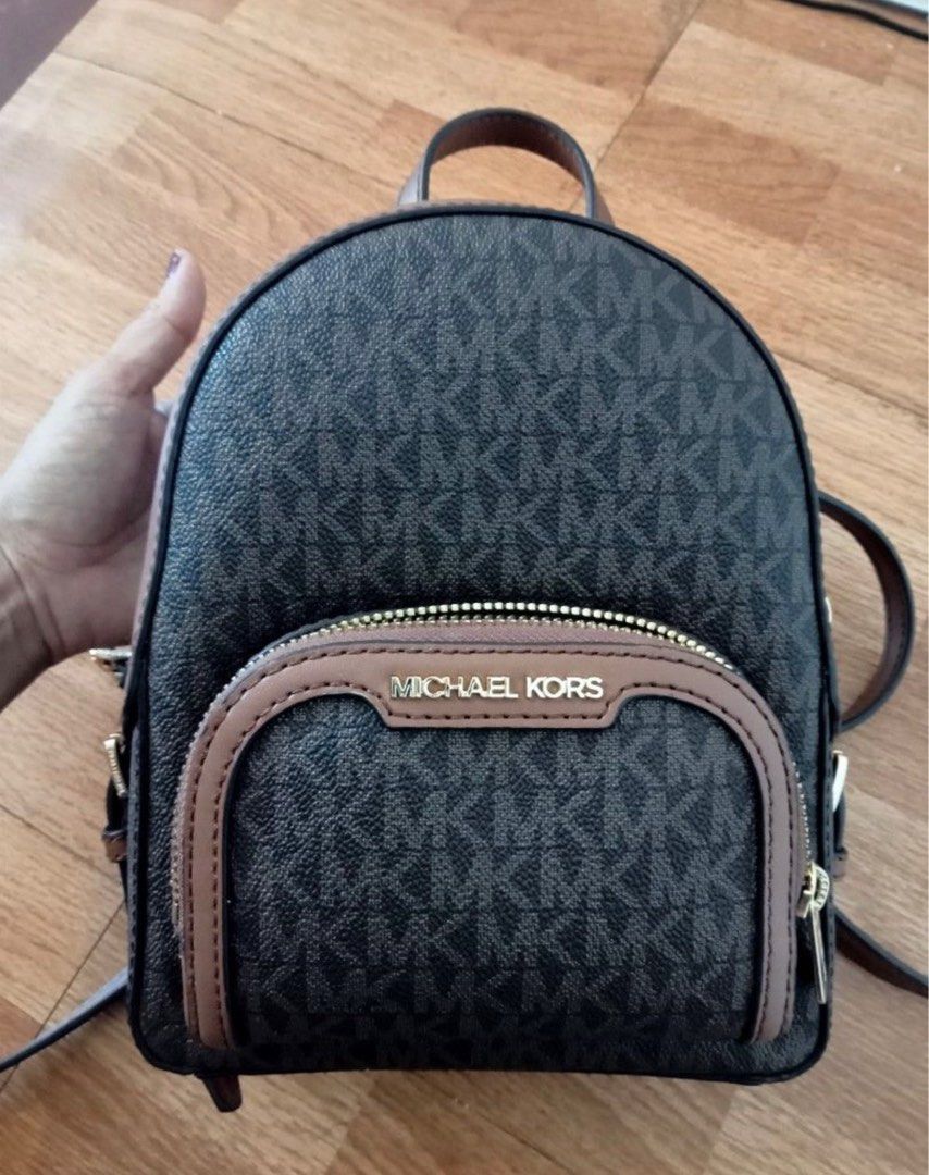 Michael kors online sling backpacks