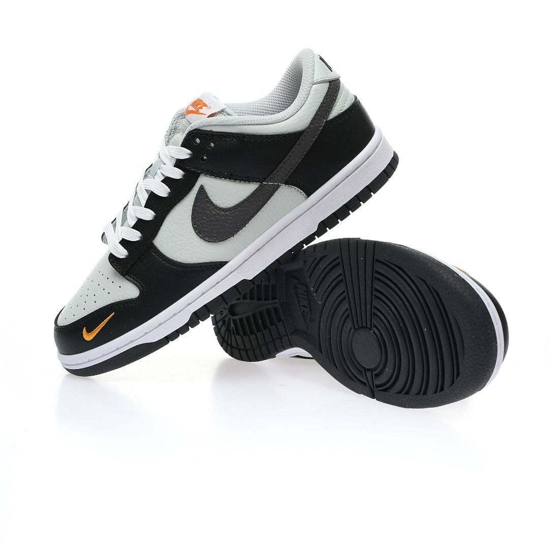 White nike shoes with orange swoosh discount