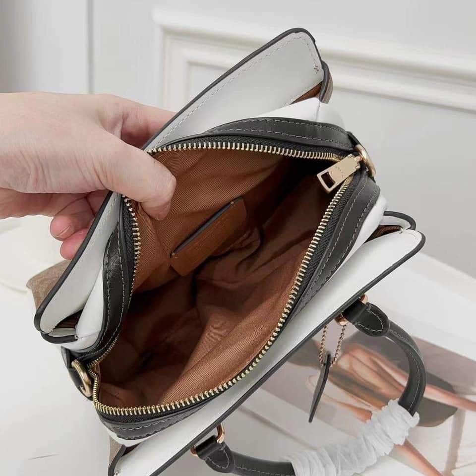 Coach Mini Darcie in Signature Canvas (Category: Luxury Bags & Wallets) located in Rizal. Submitted by LuxbyMarifrance (Listing ID 1235005091, Image 2). Description: 🏷️ 3,000 only + SF 💼 Coach Mini Darcie Carryall in Signature Canvas 📏 10 1/4” (L) x 6 3/4” (H) x 4 1/4” (W) 📌 with dust bag and paper bag ✨All trademarks, logos and brand names are reserved and property of the original brand owners. #coachph #authenticqualitybagsph #authenticqual