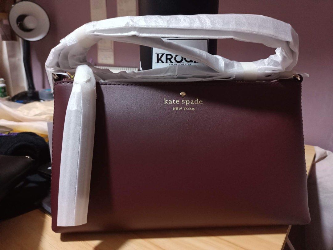 Kate Spade Amy crossbody (Category: Luxury Bags & Wallets) located in Paranaque City. Submitted by alymae27 (Listing ID 1235064609, Image 1). Description: 5.5”h x 9.5”w x 1.75”d strap drop: 22” smooth leather foil embossed logo two way spade jacquard lining zip closure dust bag not included imported Style No. WKRU4856 -BRAND NEW. Color: Cherrywood no dustbag or paperbag. Original? Yes, it’s original..