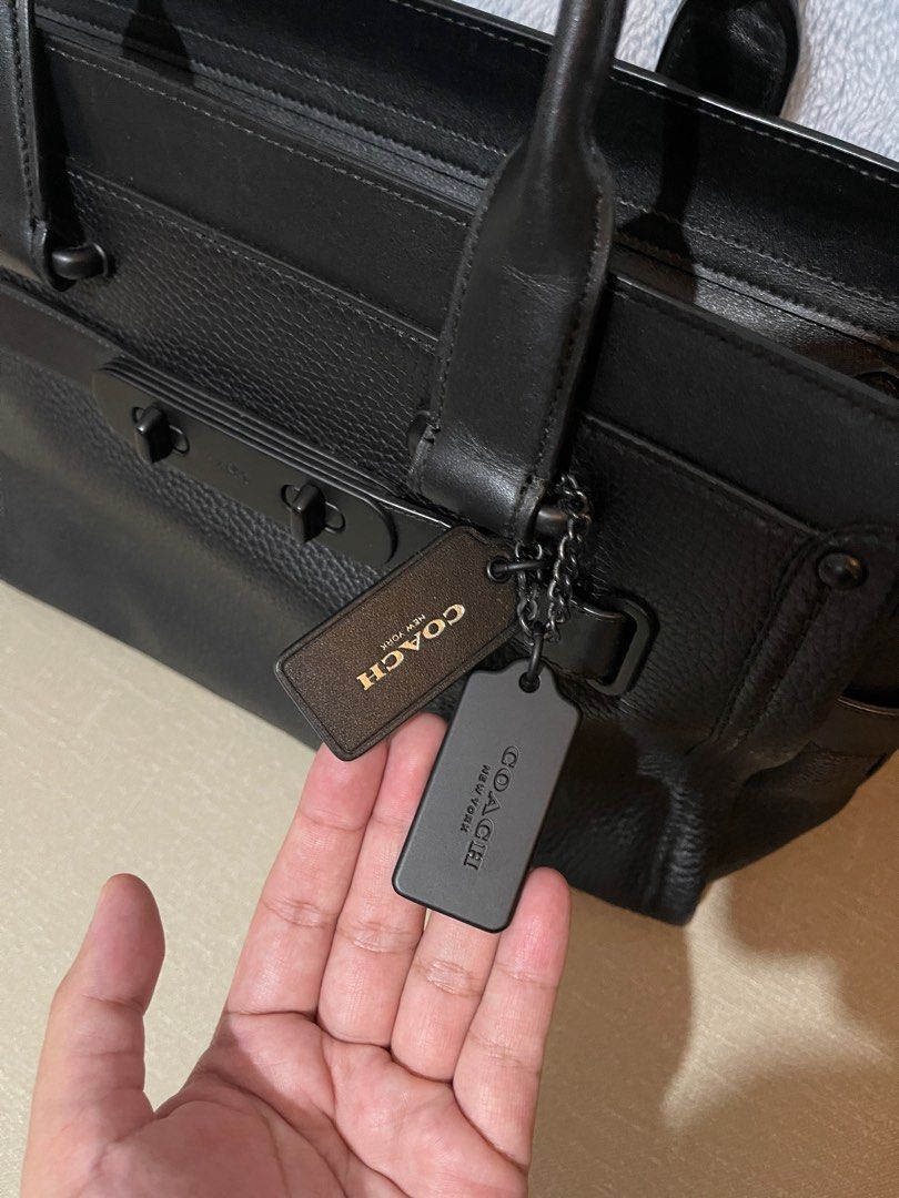 Rare Coach Swagger Leather Matte Black (Category: Cross-body Bags) located in Cainta. Submitted by jdcmd (Listing ID 1235067522, Image 2). Description: Original Bought it from US With carecard, dustbag, paperbag Kept long hence with minimal flaw (creed part) Decluttering SF c/o buyer via lalamove, grab or lbc only No COD or COP Payment first basis Gcash or bdo bank transfer only From Cainta.