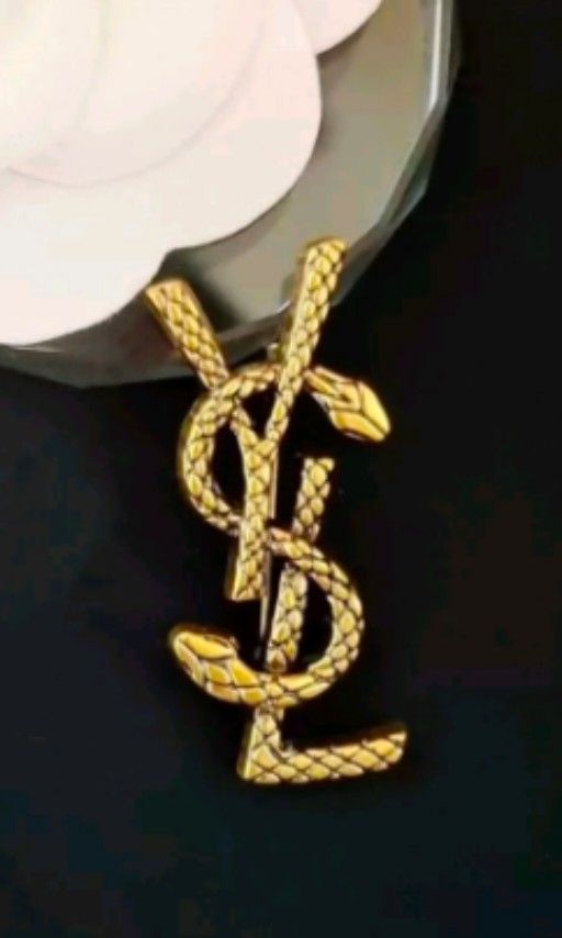 Fake ysl brooch discount