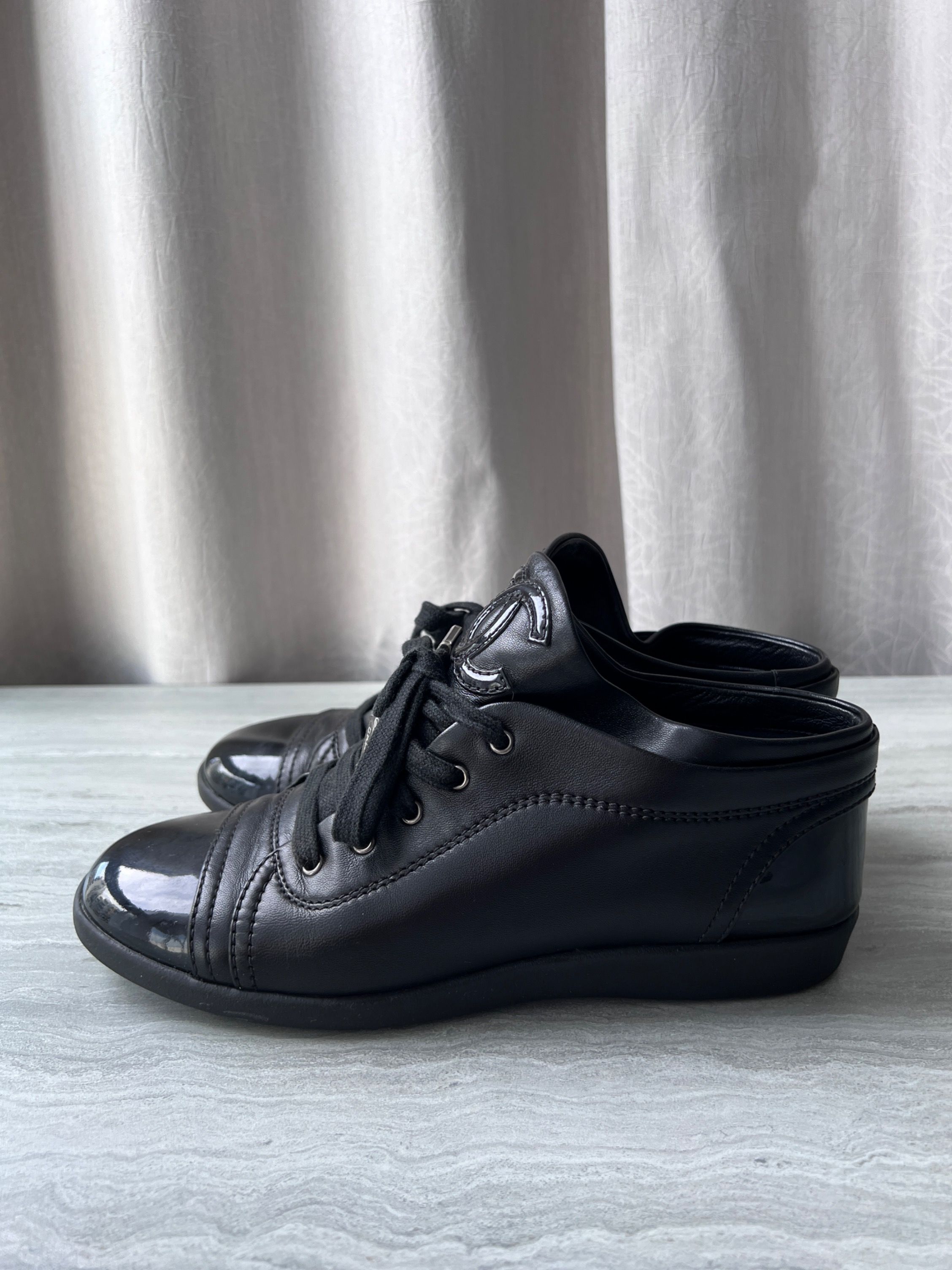 Chanel black leather sneakers store