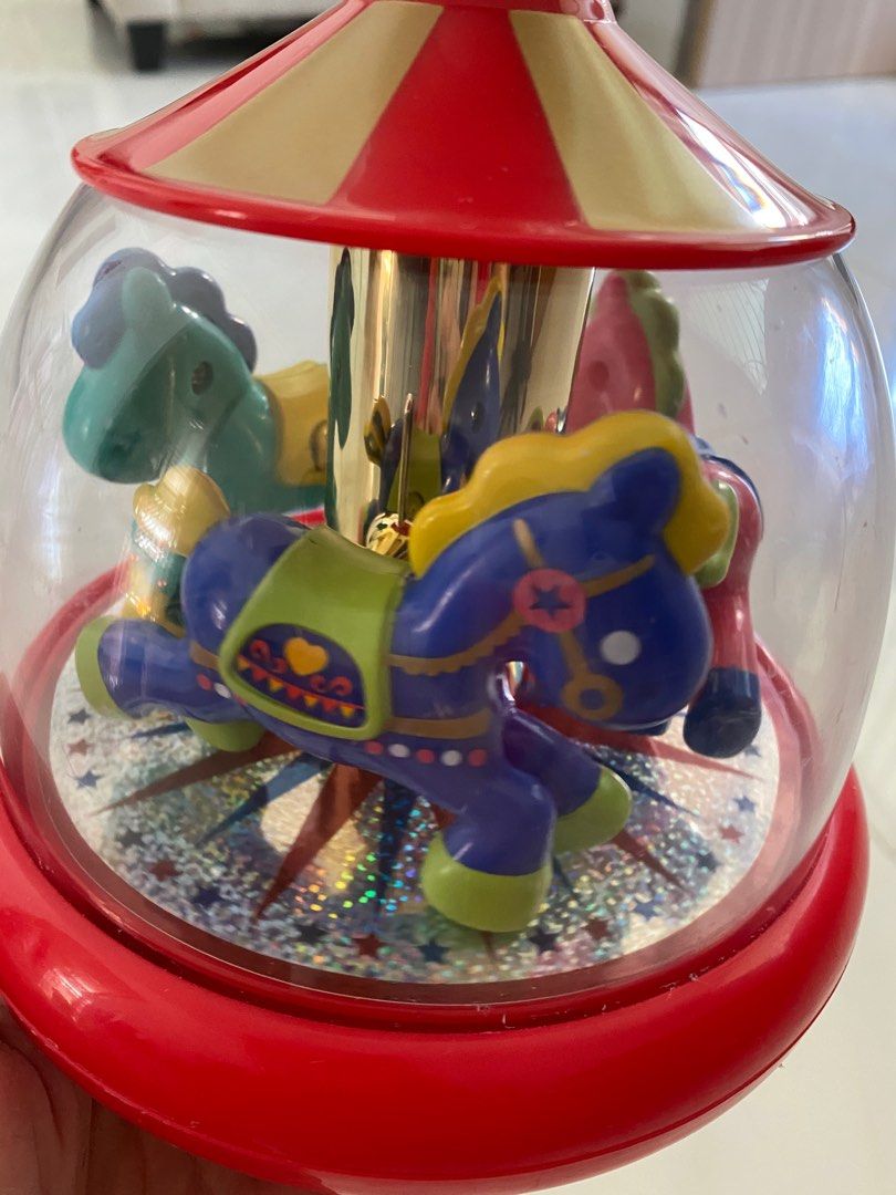 Push and spin carousel on sale