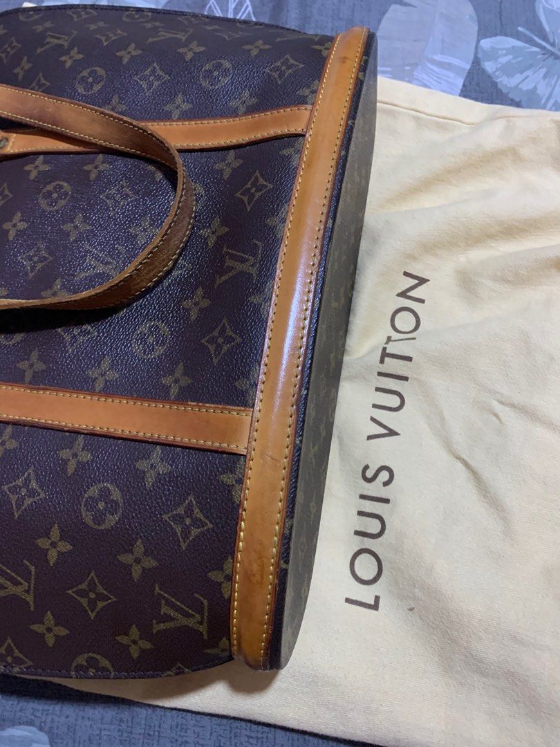 Authentic LV Babylone tote bag (Category: Luxury Bags & Wallets) located in Pasig City. Submitted by wandererme (Listing ID 1236855654, Image 2). Description: 💯 Authentic LV tote bag with visible flaws as seen in the photos. Inclusion, one dustbag. Pls DM me for more details and photos. RFS: Decluttering and needs fund.