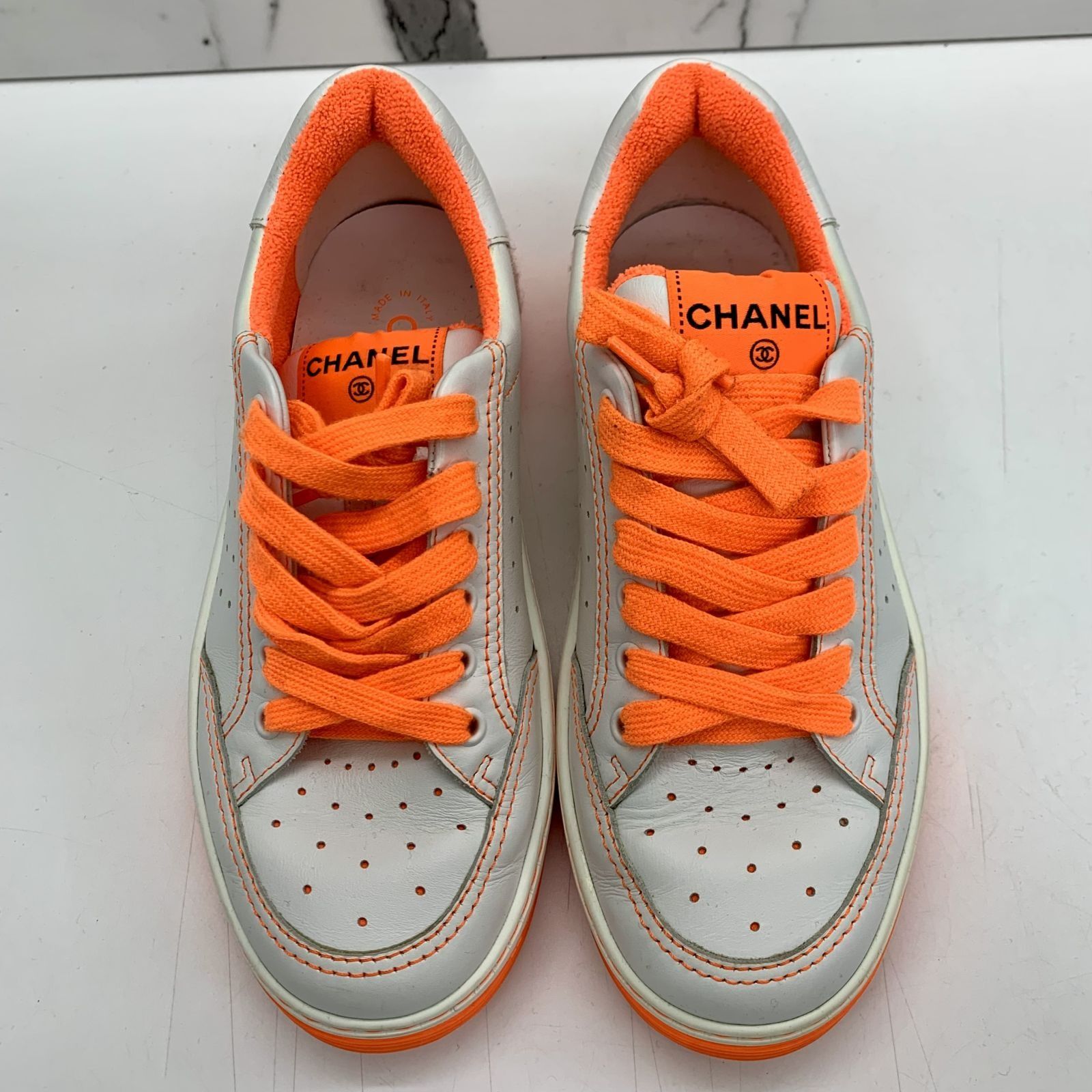 White and hotsell orange chanel sneakers