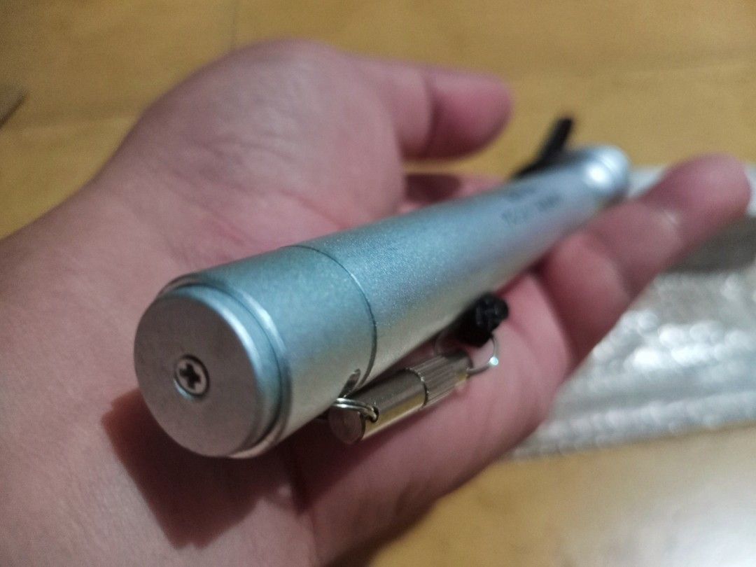Flashlight Japan Surplus (Category: Lighting) located in Silang. Submitted by pickright (Listing ID 1236944565, Image 3). Description: Tested 100% working. Seven-inch sturdy flashlight from Japan. Its body is made up of Aluminum Alloy. It has a spare bulb secured inside the piece of metal tube located at its string. Please see photos provided. No battery included..