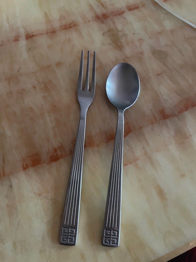 Givenchy tea spoon and tea fork set (Category: Dinnerware & Cutlery) located in Manila. Submitted by aneajmik (Listing ID 1236825641, Image 1). Description: Can be use as cocktail and dessert utensils too. Original! Well loved! Signs of usage but still looks nice! Authentic Givenchy stainless steel..