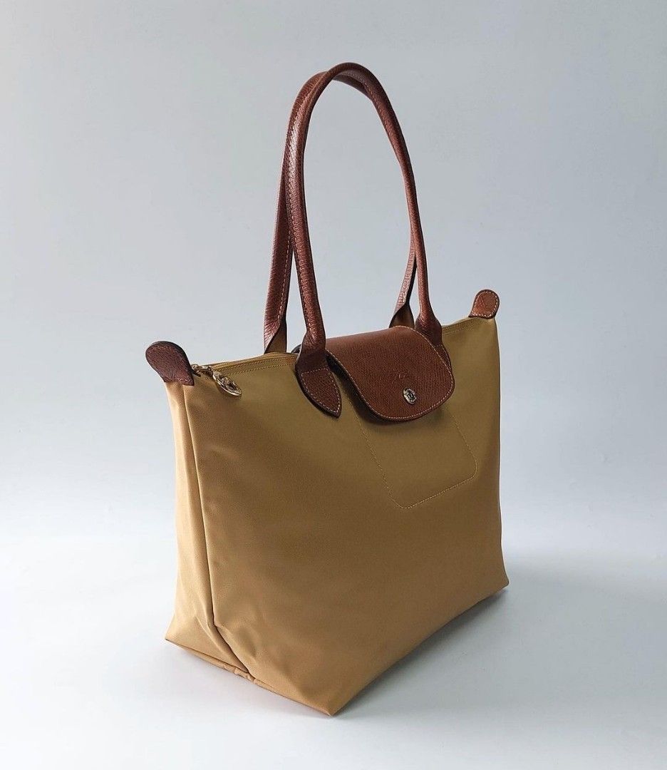 Longchamp Dessert Beige (Category: Tote Bags) located in Quezon City. Submitted by asrcollections (Listing ID 1236789971, Image 2). Description: 💥NEW COLOR TO ADD TO YOUR COLLECTIONS 😊❤️ 📍Dessert ✅Medium 3000 14 w top x 10 w base x 10 h x 6 d inches ✅Large 3500 18 w top x 12 w base x 12 h inches Onhand and Ready to ship.