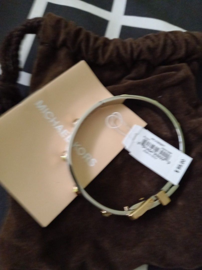 Michael Kors belt bangle 2toned at Php3500. No meet ups (Category: Bracelets) located in Paranaque City. Submitted by closetisfullbackup (Listing ID 1236811552, Image 1). Description: fr us w/pouch, 2.2 - 2.5 inches.