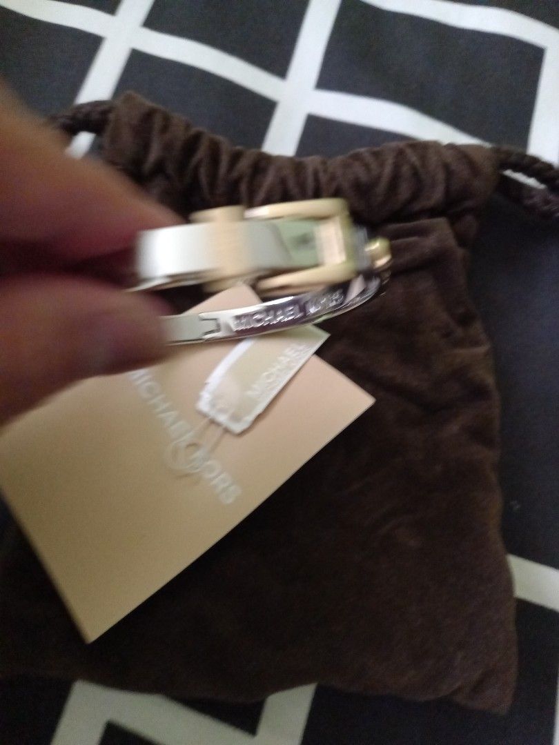 Michael Kors belt bangle 2toned at Php3500. No meet ups (Category: Bracelets) located in Paranaque City. Submitted by closetisfullbackup (Listing ID 1236811552, Image 3). Description: fr us w/pouch, 2.2 - 2.5 inches.