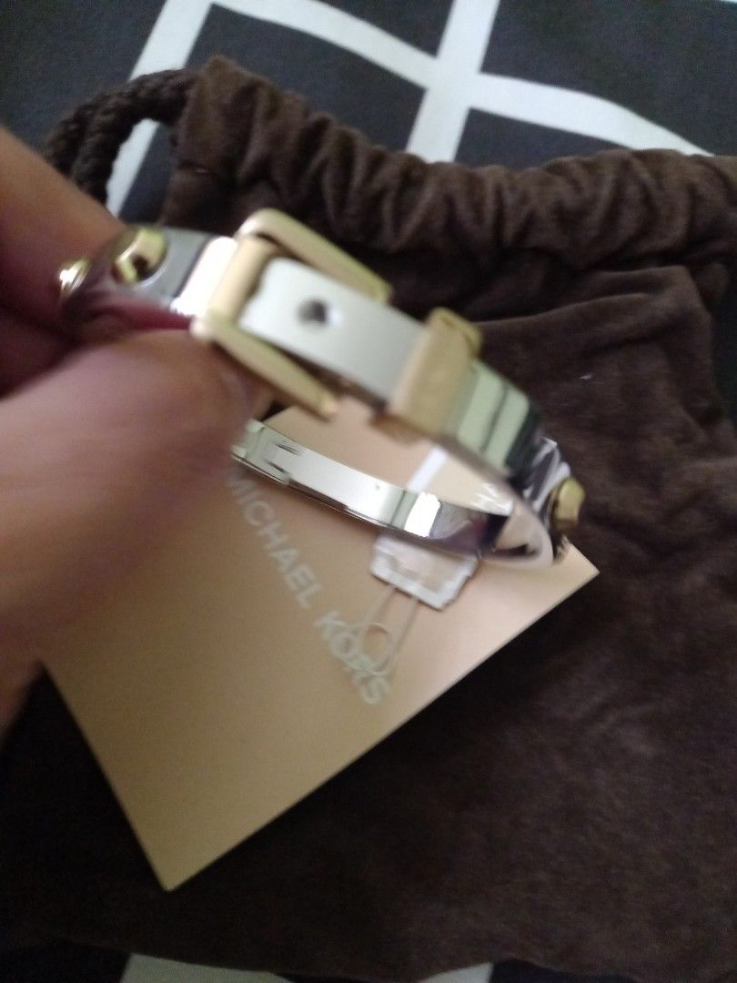 Michael Kors belt bangle 2toned at Php3500. No meet ups (Category: Bracelets) located in Paranaque City. Submitted by closetisfullbackup (Listing ID 1236811552, Image 2). Description: fr us w/pouch, 2.2 - 2.5 inches.