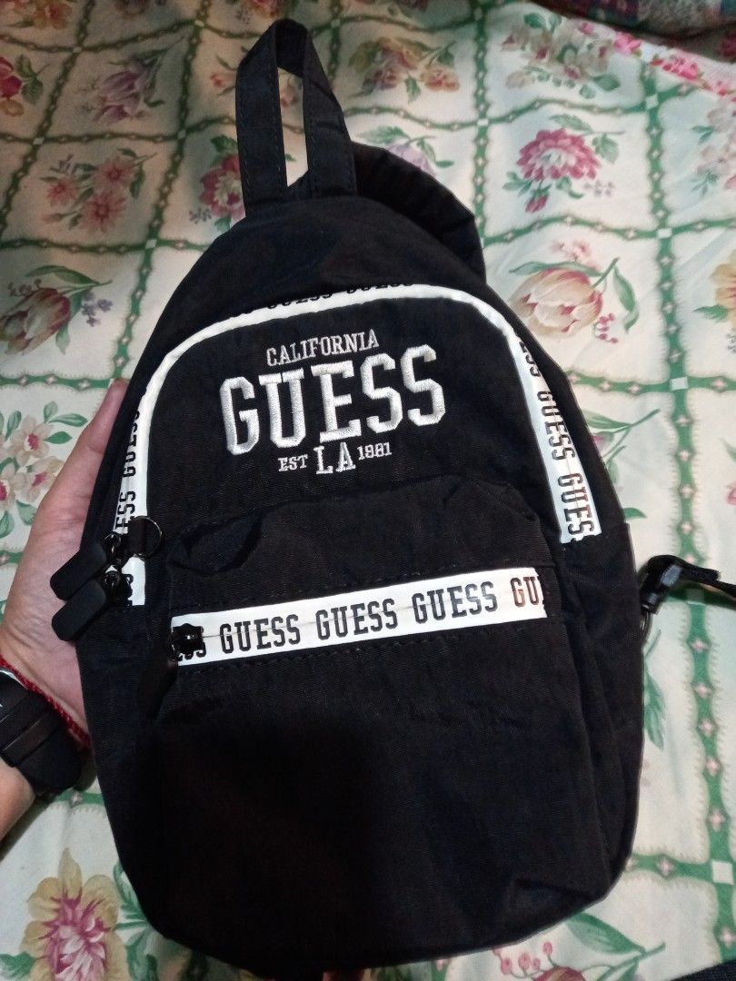 Authentic Guess Body Bag Unisex (Category: Backpacks) located in Marilao. Submitted by MusicAndThings (Listing ID 1237079749, Image 2). Description: Used Twice RFS: Decluttering No Issues Fits Folding Umbrella, Wallet, Bottled Water, Smartfone, Powerbank, Keys..
