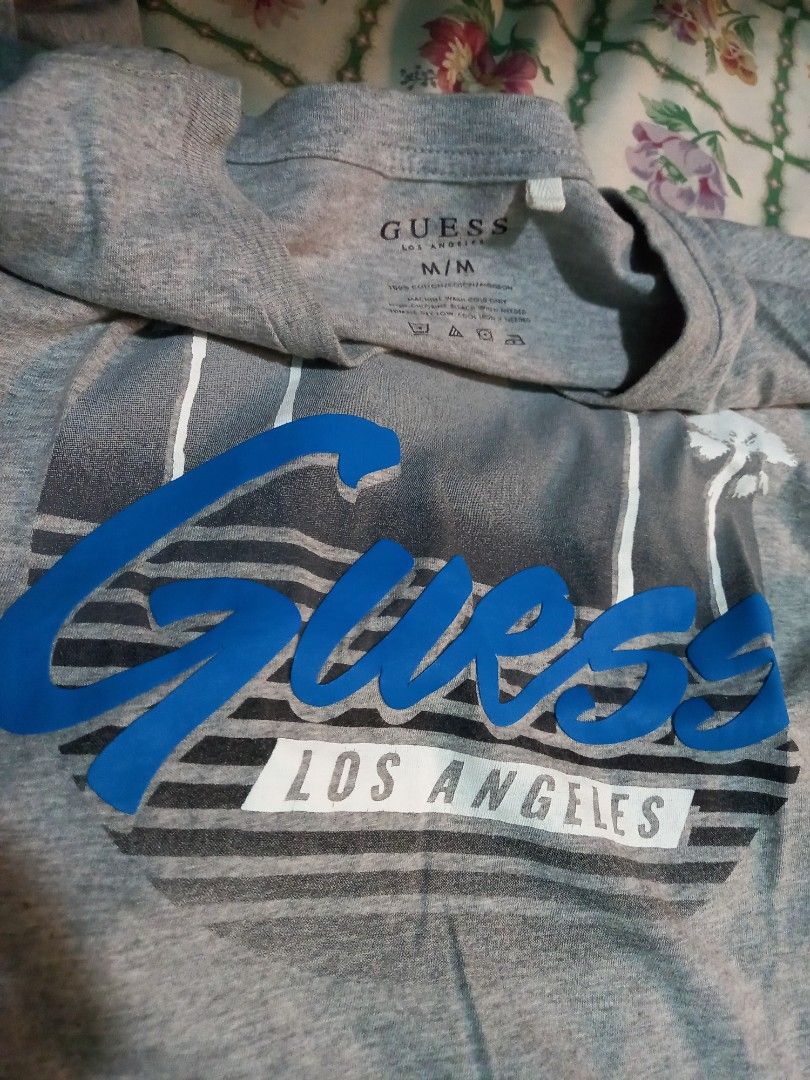 Authentic Guess USA Tee Shirt (Category: Tshirts & Polo Shirts ) located in Marilao. Submitted by MusicAndThings (Listing ID 1237081818, Image 3). Description: Vintage Print Design Style (Rubberised) Guess Tee Size Medium W19×L25 Slim Fit Fits up to Large.
