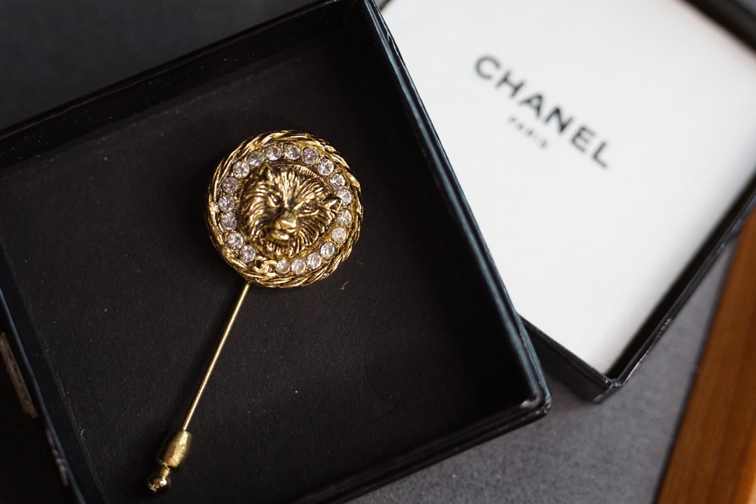 Chanel lion brooch best sale