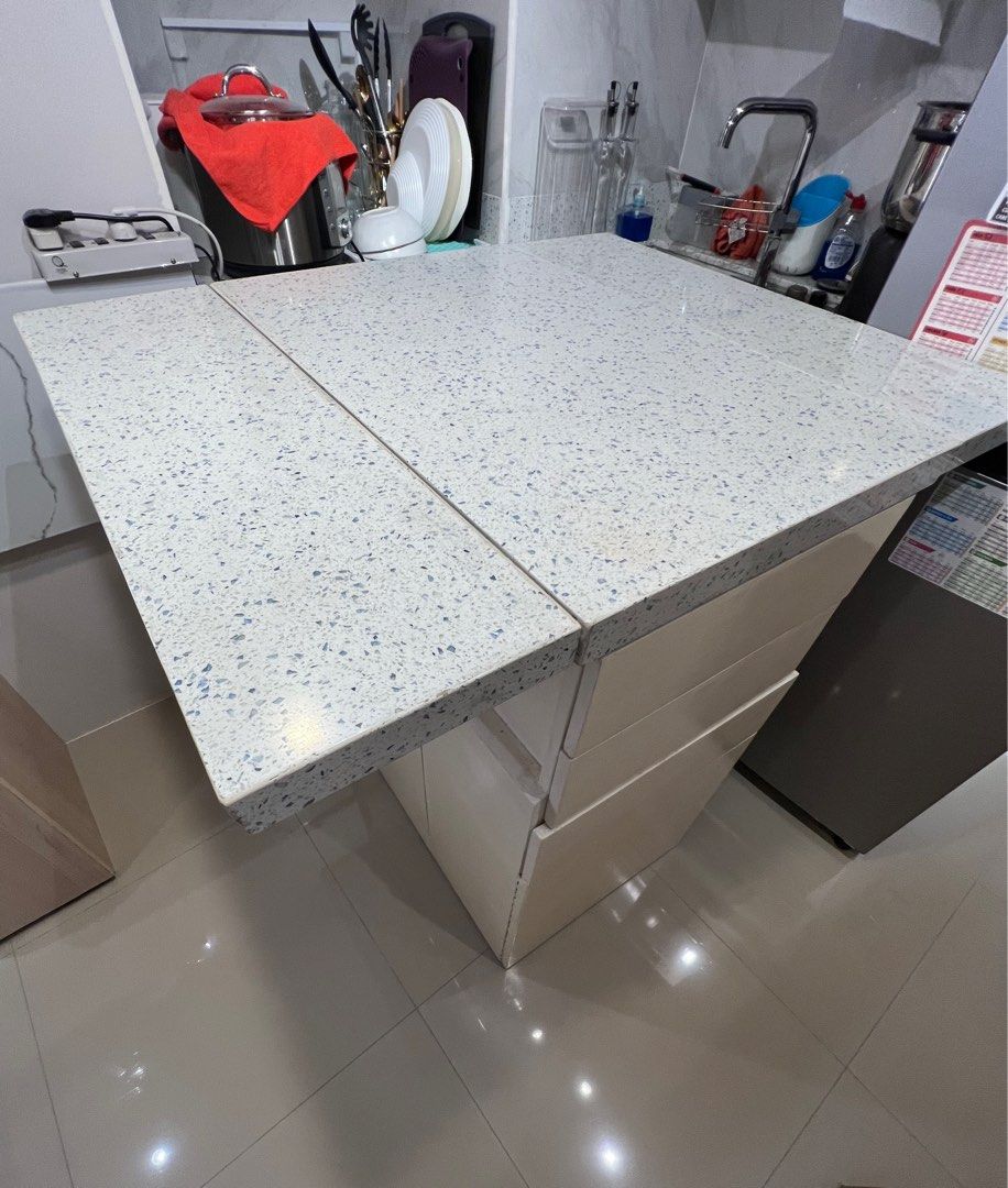 Customized Quartz expandable table with storage (Category: Tables & Sets) located in Makati City. Submitted by rumnougat (Listing ID 1237022411, Image 3). Description: Customized expandable table QUARTZ!!! Drawers/storage from both ends and in the middle. Maximized space!! Also has wheels to easily move it. Disclaimer: it’s heavy because of the quartz. Pickup QC by buyer Rfs: moving out.