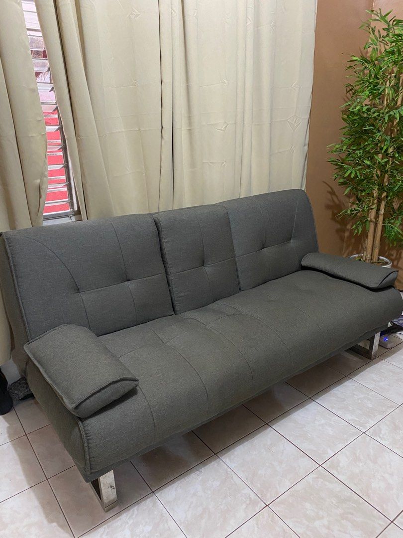 Gray sofa bed with cup holders on Carousell